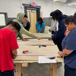 Chattanooga State Community College students practice installing flooring at the ChattState Construction Career Center.